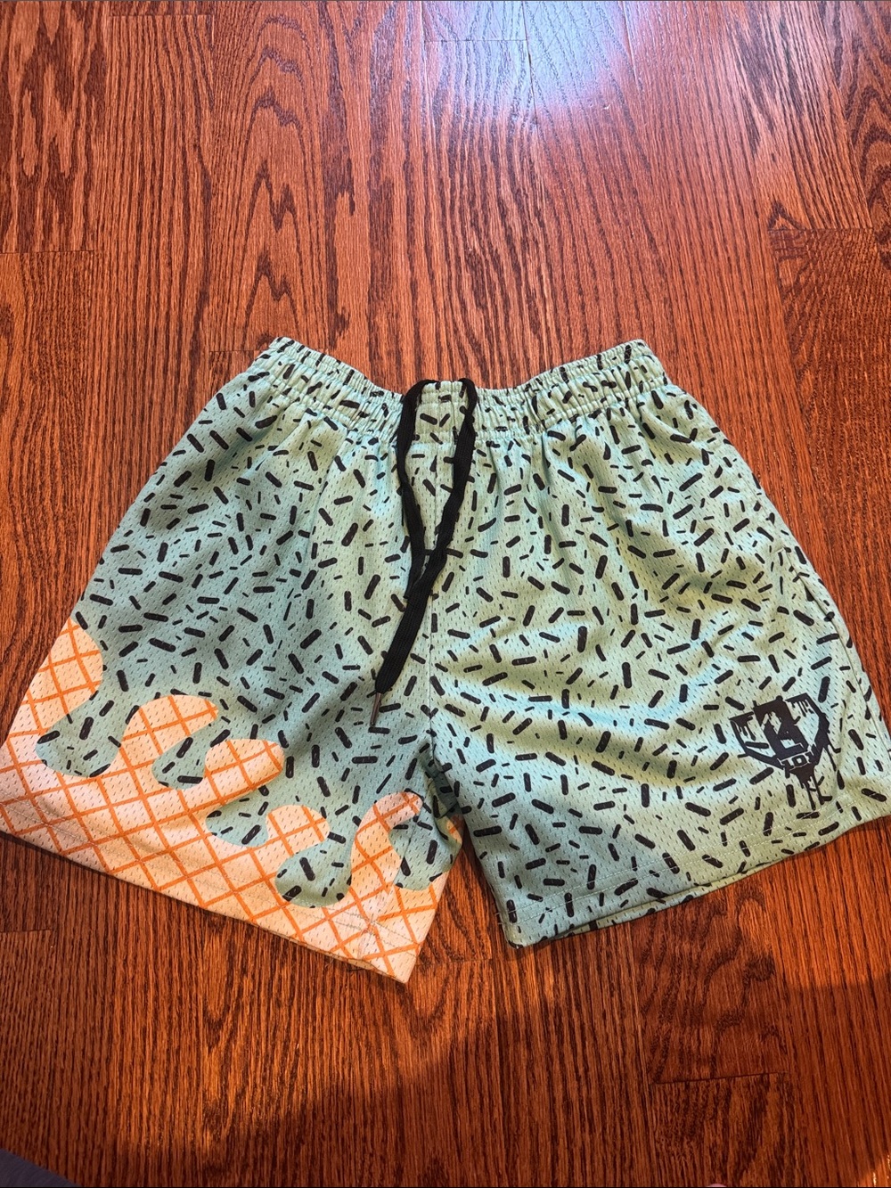 Kids Printed Mint Green Swim Shorts with Orange Accent